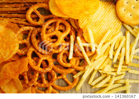 Mix of variety snack chips pretzel and cracker, junk crunchy food. Mix of variety snack chips pretzel and cracker, junk crunchy food. 141360167