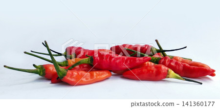 A pile of fresh red bird's eye chilies, shot from a low angle. A pile of fresh red bird's eye chilies, shot from a low angle. 141360177