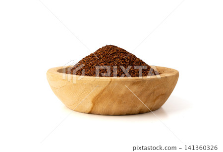 Rooibos tea leaves isolated in wood bowl Rooibos tea leaves isolated in wood bowl 141360326