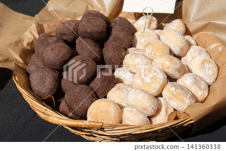 Chocolate truffle balls, cocoa and hazelnut round cookies close up Chocolate truffle balls, cocoa and hazelnut round cookies close up 141360338