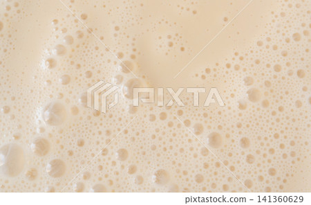 Coffee milkshake texture closeup Coffee milkshake texture closeup 141360629
