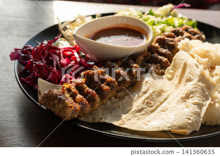Moroccan Beef Kebab on Skewers, Traditional Arabian Food, Mutton Shashlik Moroccan Beef Kebab on Skewers, Traditional Arabian Food, Mutton Shashlik 141360635