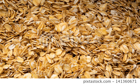 Oat flakes textured pattern, rolled oatmeal macro background 141360671