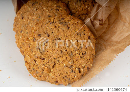 Whole and broken oatmeal cookies, cereal biscuits, fitness bakery Whole and broken oatmeal cookies, cereal biscuits, fitness bakery 141360674