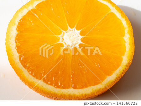 Orange fruit slice macro textured background Orange fruit slice macro textured background 141360722