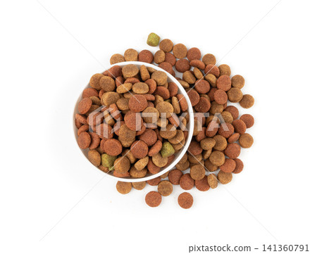Dry pet food, dog color kibble pile, puppy meat and vegetable pellets, canine protein granules Dry pet food, dog color kibble pile, puppy meat and vegetable pellets, canine protein granules 141360791