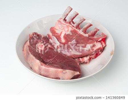 Raw lamb rack isolated, fresh mutton fillet with ribs, tenderloin pieces, mutton rump sirloin meat Raw lamb rack isolated, fresh mutton fillet with ribs, tenderloin pieces, mutton rump sirloin meat 141360849