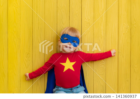 Little boy dressed as a superhero having fun at home Little boy dressed as a superhero having fun at home 141360937
