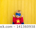 Little boy dressed as a superhero having fun at home 141360938