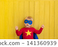 Little boy dressed as a superhero having fun at home 141360939