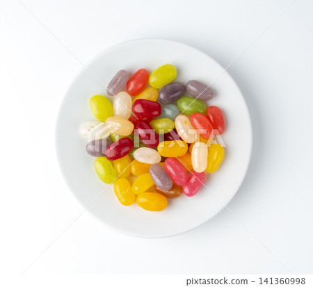 Jelly beans gummy candy pile, colorful marmalade pills Jelly beans gummy candy pile, colorful marmalade pills 141360998