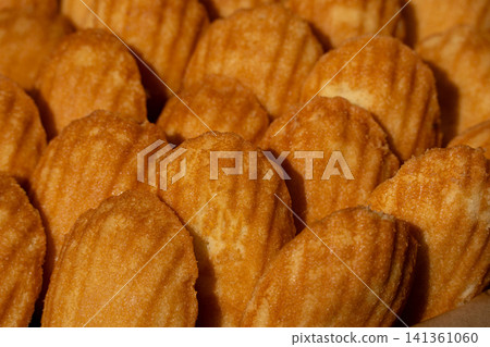 Madeleines or french tea cakes in a basket Madeleines or french tea cakes in a basket 141361060