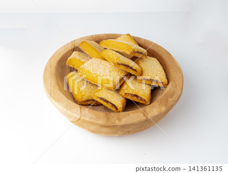 Fig roll bar, square sugar cookies with fruit filling isolated Fig roll bar, square sugar cookies with fruit filling isolated 141361135