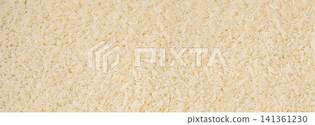 Grated coconut powder. Dry coco flakes pile, shredded desiccated coconut, tropical fruit chips Grated coconut powder. Dry coco flakes pile, shredded desiccated coconut, tropical fruit chips 141361230