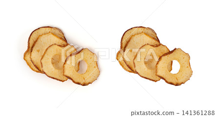 Dry apple slices isolated, dried apple chips, healthy fruit snack Dry apple slices isolated, dried apple chips, healthy fruit snack 141361288