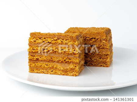 Honey cake isolated, medovik dessert piece Honey cake isolated, medovik dessert piece 141361301