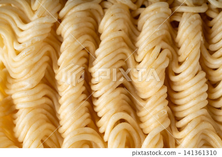 Instant noodles texture background, dry ramen noodle macro pattern Instant noodles texture background, dry ramen noodle macro pattern 141361310