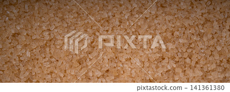 Brown cane sugar pile textured background top view Brown cane sugar pile textured background top view 141361380