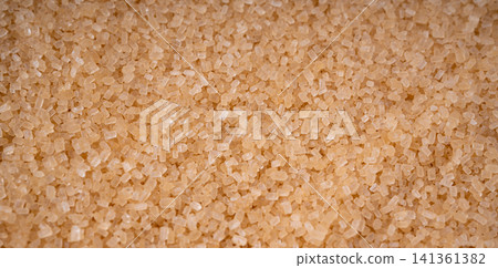 Brown cane sugar pile textured background top view Brown cane sugar pile textured background top view 141361382