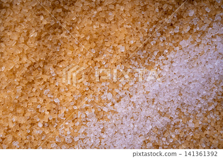 Brown cane sugar pile textured background top view Brown cane sugar pile textured background top view 141361392