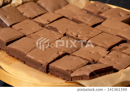 Brownie pile on paper. Chocolate cakes stack 141361399
