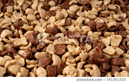 Chocolate cereal flakes textured background closeup Chocolate cereal flakes textured background closeup 141361535