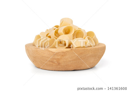 Raw Calamarata Big Pasta Isolated, Homemade Dry Macaroni, Italian Raw Round Noodle Raw Calamarata Big Pasta Isolated, Homemade Dry Macaroni, Italian Raw Round Noodle 141361608