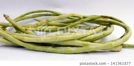 Fresh long beans on a white background Fresh long beans on a white background 141361877
