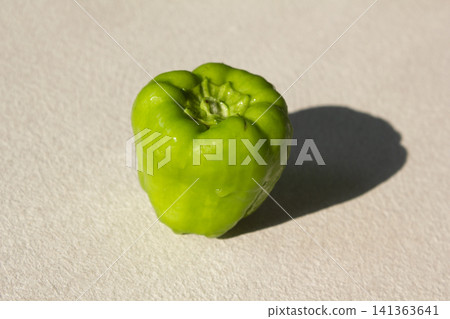 It is a close-up of a green bell pepper. It is a close-up of a green bell pepper. 141363641