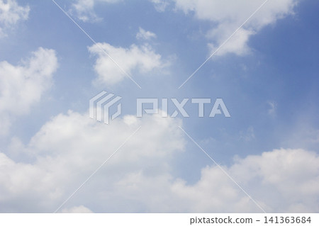 It is a blue sky and fluffy clouds. It is a blue sky and fluffy clouds. 141363684
