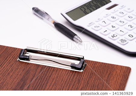 Image of accounting and calculation work with a wood grain theme. 141363929