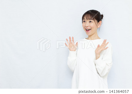 Smiling and surprised woman Smiling and surprised woman 141364057