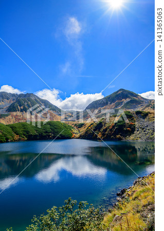 Mikurigaike Pond: A breathtaking autumn view from Murodo Plateau on the Tateyama Kurobe Alpine Route, Toyama Prefecture. Mikurigaike Pond: A breathtaking autumn view from Murodo Plateau on the Tateyama Kurobe Alpine Route, Toyama Prefecture. 141365063
