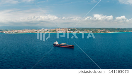 Cargo vessel anchored in Mediterranean Sea near Tarragona coastline Spain Cargo vessel anchored in Mediterranean Sea near Tarragona coastline Spain 141365073