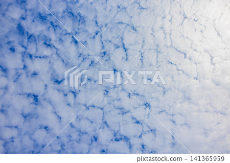 Cirrocumulus clouds and gaps in the summer blue sky Cirrocumulus clouds and gaps in the summer blue sky 141365959