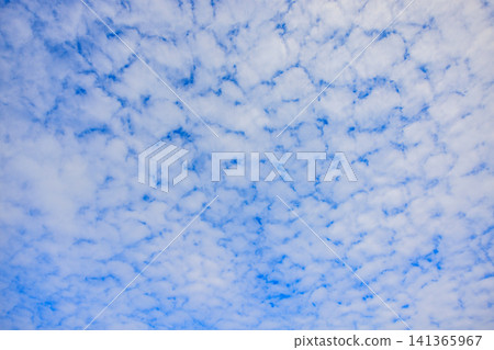 Cirrocumulus clouds and gaps in the summer blue sky Cirrocumulus clouds and gaps in the summer blue sky 141365967
