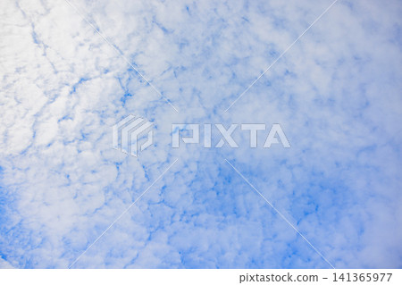 Cirrocumulus clouds and gaps in the summer blue sky Cirrocumulus clouds and gaps in the summer blue sky 141365977