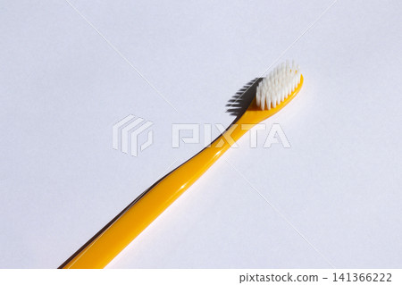 It is a colorful toothbrush. It is a colorful toothbrush. 141366222
