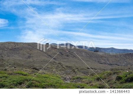 A view of Mount Aso's Nakadake volcano, emitting volcanic smoke, from the top of Mount Aso, Kumamoto Prefecture. A view of Mount Aso's Nakadake volcano, emitting volcanic smoke, from the top of Mount Aso, Kumamoto Prefecture. 141366443