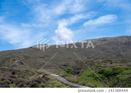 A view of Mount Aso's Nakadake volcano, emitting volcanic smoke, from the top of Mount Aso, Kumamoto Prefecture. A view of Mount Aso's Nakadake volcano, emitting volcanic smoke, from the top of Mount Aso, Kumamoto Prefecture. 141366444
