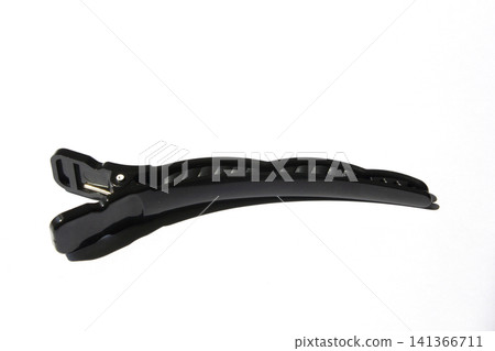 It is a hair clip from a hair salon placed on a white background. It is a hair clip from a hair salon placed on a white background. 141366711