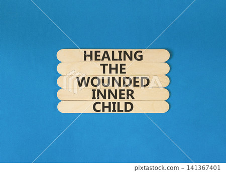 Healing the wounded inner child symbol. Concept words Healing the wounded inner child on beautiful wooden sticks. Beautiful blue background. Psychological Healing inner child concept. Copy space. Healing the wounded inner child symbol. Concept words Healing the wounded inner child on beautiful wooden sticks. Beautiful blue background. Psychological Healing inner child concept. Copy space. 141367401