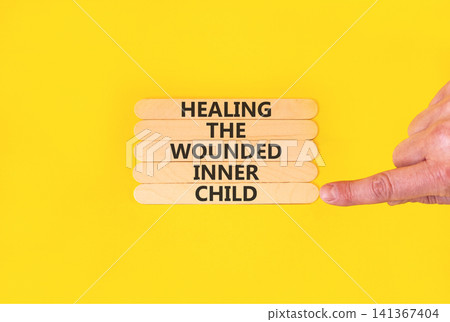 Healing the wounded inner child symbol. Concept words Healing the wounded inner child on beautiful wooden sticks. Beautiful yellow background. Psychological Healing inner child concept. Copy space. Healing the wounded inner child symbol. Concept words Healing the wounded inner child on beautiful wooden sticks. Beautiful yellow background. Psychological Healing inner child concept. Copy space. 141367404