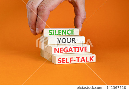 Silence your negative self-talk symbol. Concept words Silence your negative self-talk on beautiful wooden blocks. Beautiful orange background. Psychological negative self-talk concept. Copy space. Silence your negative self-talk symbol. Concept words Silence your negative self-talk on beautiful wooden blocks. Beautiful orange background. Psychological negative self-talk concept. Copy space. 141367518