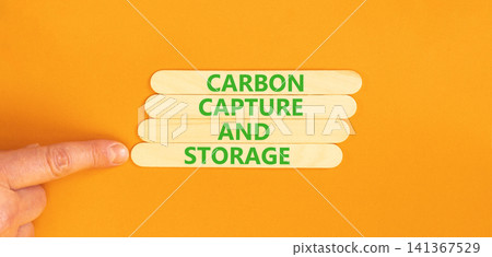 Carbon capture and storage words symbol. Concept words Carbon capture and storage on beautiful wooden sticks. Beautiful orange background. Business carbon capture and storage concept. Copy space. Carbon capture and storage words symbol. Concept words Carbon capture and storage on beautiful wooden sticks. Beautiful orange background. Business carbon capture and storage concept. Copy space. 141367529