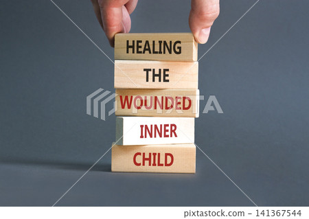 Healing the wounded inner child symbol. Concept words Healing the wounded inner child on beautiful wooden blocks. Beautiful grey background. Psychological Healing inner child concept. Copy space. Healing the wounded inner child symbol. Concept words Healing the wounded inner child on beautiful wooden blocks. Beautiful grey background. Psychological Healing inner child concept. Copy space. 141367544