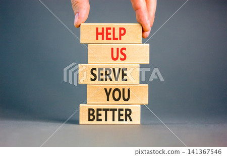 Help us serve you better symbol. Concept words Help us serve you better on beautiful wooden blocks. Beautiful grey background. Business and help us serve you better concept. Copy space. 141367546