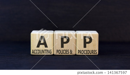 APP accounting policies and procedures symbol. Concept words APP accounting policies and procedures on beautiful wooden blocks. Beautiful black background. Business APP concept. Copy space. APP accounting policies and procedures symbol. Concept words APP accounting policies and procedures on beautiful wooden blocks. Beautiful black background. Business APP concept. Copy space. 141367597