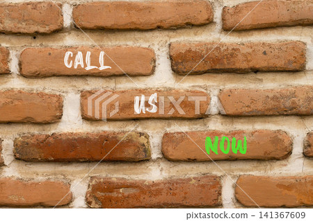 Call us now words symbol. Concept words Call us now on beautiful brick wall. Beautiful brick wall background. Business support motivational and call us now concept. Copy space. Call us now words symbol. Concept words Call us now on beautiful brick wall. Beautiful brick wall background. Business support motivational and call us now concept. Copy space. 141367609