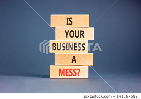 Is your business a mess symbol. Concept words Is your business a mess on beautiful wooden blocks. Beautiful grey background. Is your business a mess concept. Copy space. Is your business a mess symbol. Concept words Is your business a mess on beautiful wooden blocks. Beautiful grey background. Is your business a mess concept. Copy space. 141367682